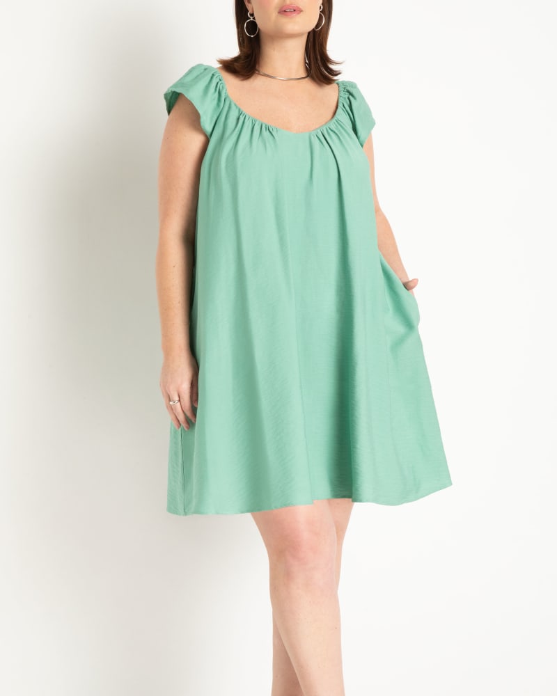 Front of a model wearing a size 24 Puff Sleeve Mini Dress in Feldspar by ELOQUII. | dia_product_style_image_id:303855